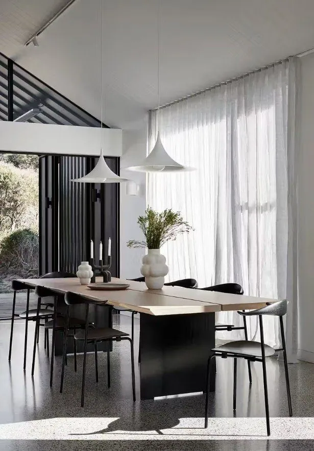 Polished concrete flooring in a modern Gold Coast and Brisbane home dining space by OzGrind