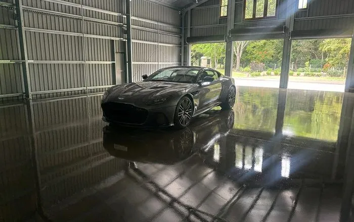 Grind and seal garage floor Brisbane Sports car on a high-gloss grind and seal garage floor in Brisbane