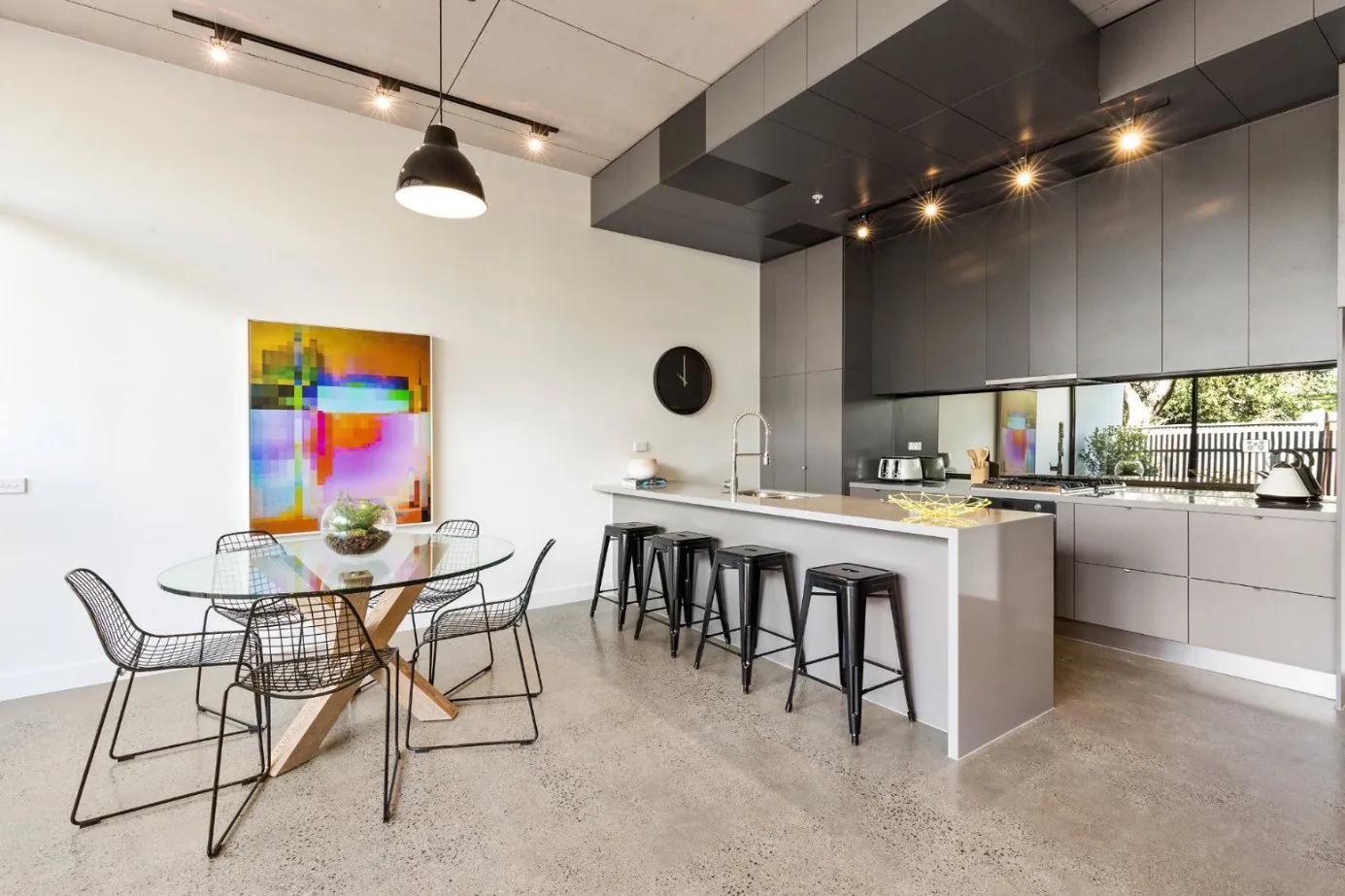 Grind and seal concrete floor in a Brisbane home kitchen and dining area