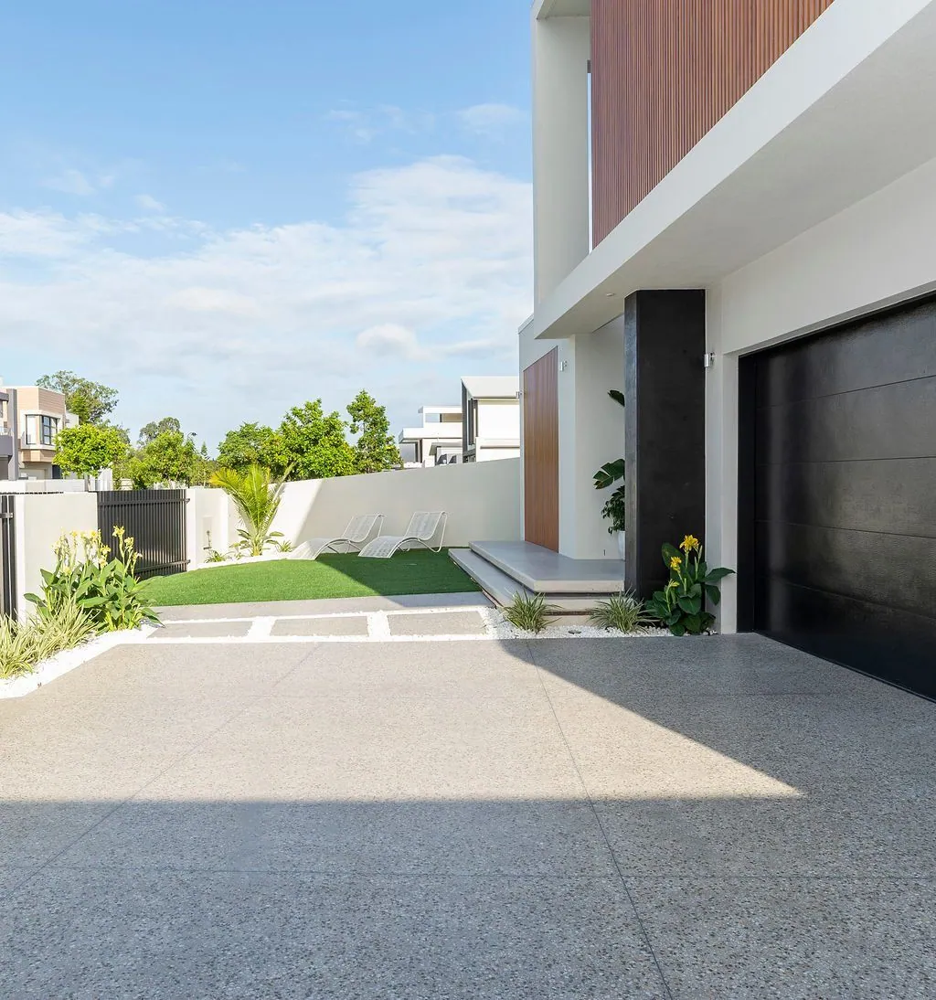 Sealed honed concrete driveway at dusk in Brisbane