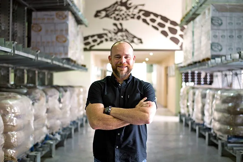 Zarraffas Coffee founder in the warehouse with polished concrete industrial floors, Brisbane