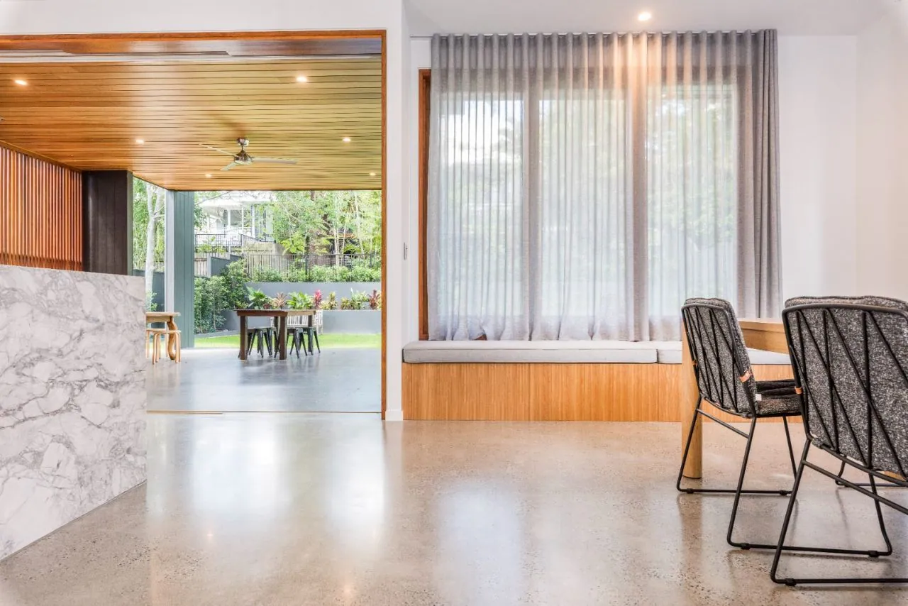 MPC semi-gloss polished concrete in a living area with marble and timber