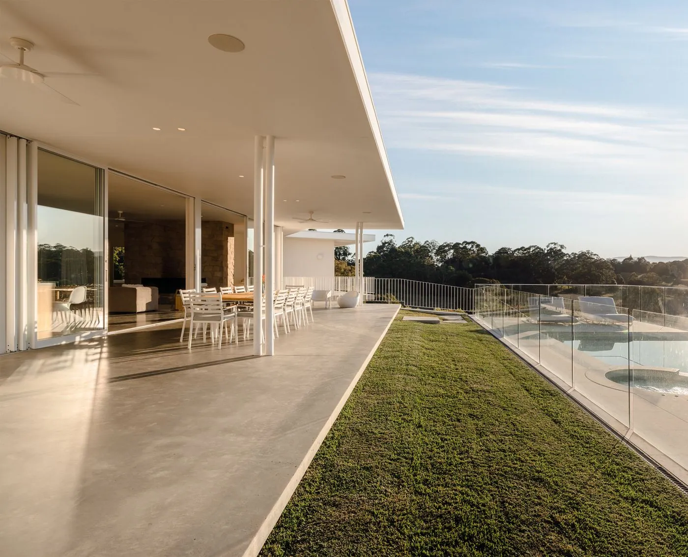 Polished concrete terrace overlooking a pool on the Sunshine Coast