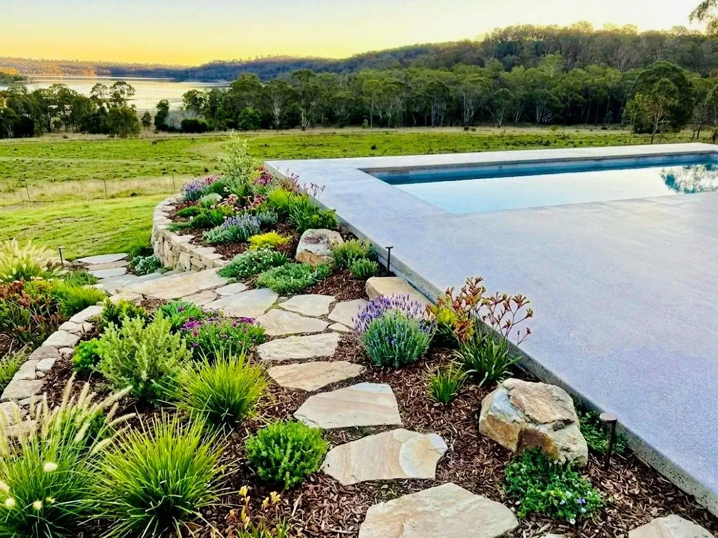 Honed concrete pool surround on a sunny day in Brisbane
