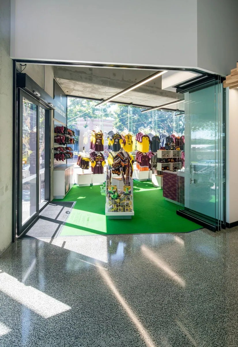Full stone exposure grind and seal concrete floor through the column foyer at the Brisbane Broncos Clive Berghofer Centre, Red Hill
