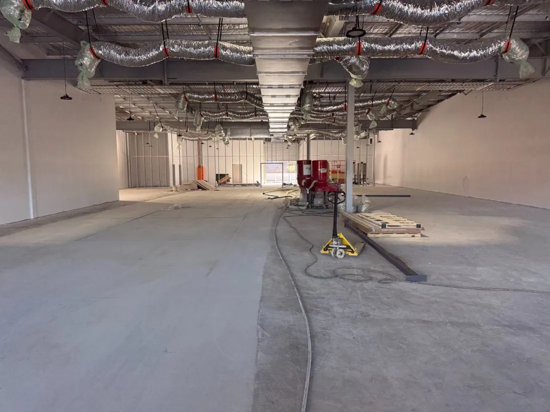Concrete floor grinding in a Brisbane retail tenancy fitout