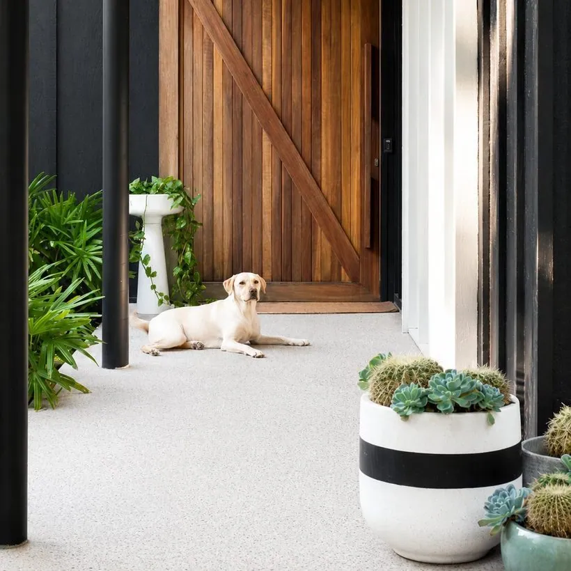 Outdoor honed and polished concrete entry and patio at a Brisbane Gold Coast home