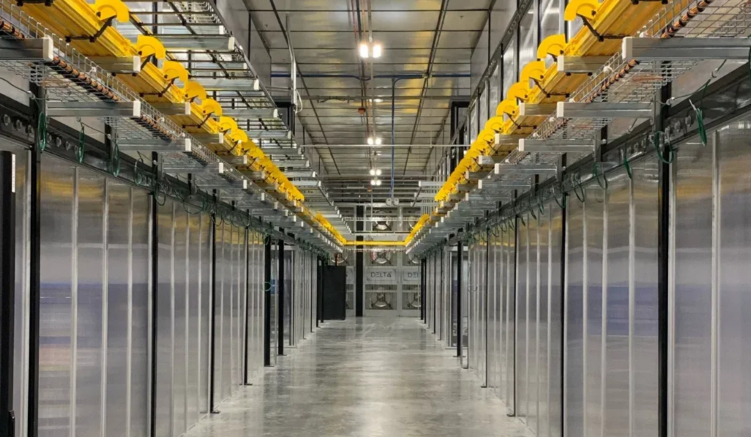 Polished concrete floor running the length of a data centre server aisle