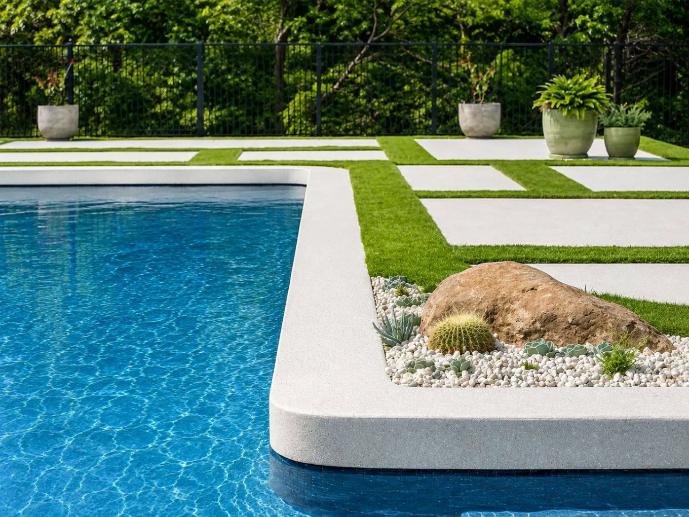All-white honed concrete pool coping and garden tiles at the Ready Set Reno dream home