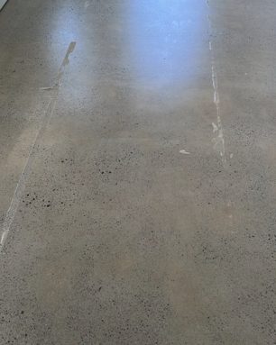 Lifted Along Tape Lines on a grind and seal concrete floor