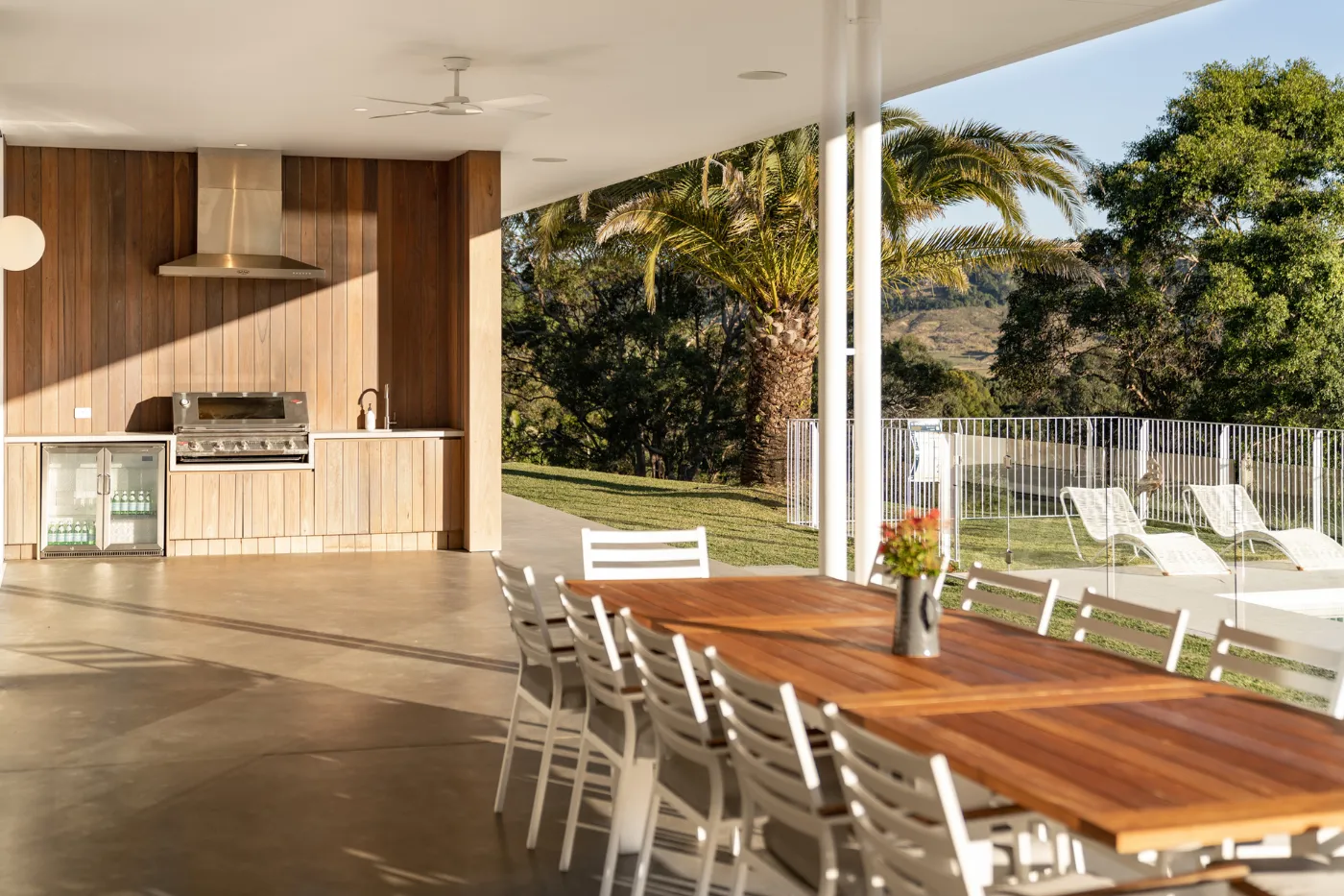 Honed concrete alfresco outdoor kitchen floor with rural views in Brisbane