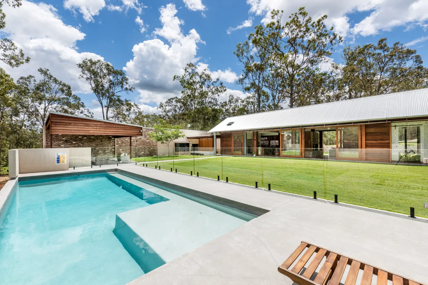 Nil exposure honed concrete pool surround at a Wights Mountain acreage home, Brisbane