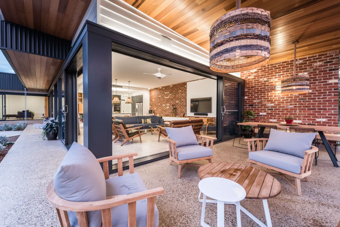 Exposed aggregate honed concrete entertaining floor at a Taringa house, Brisbane