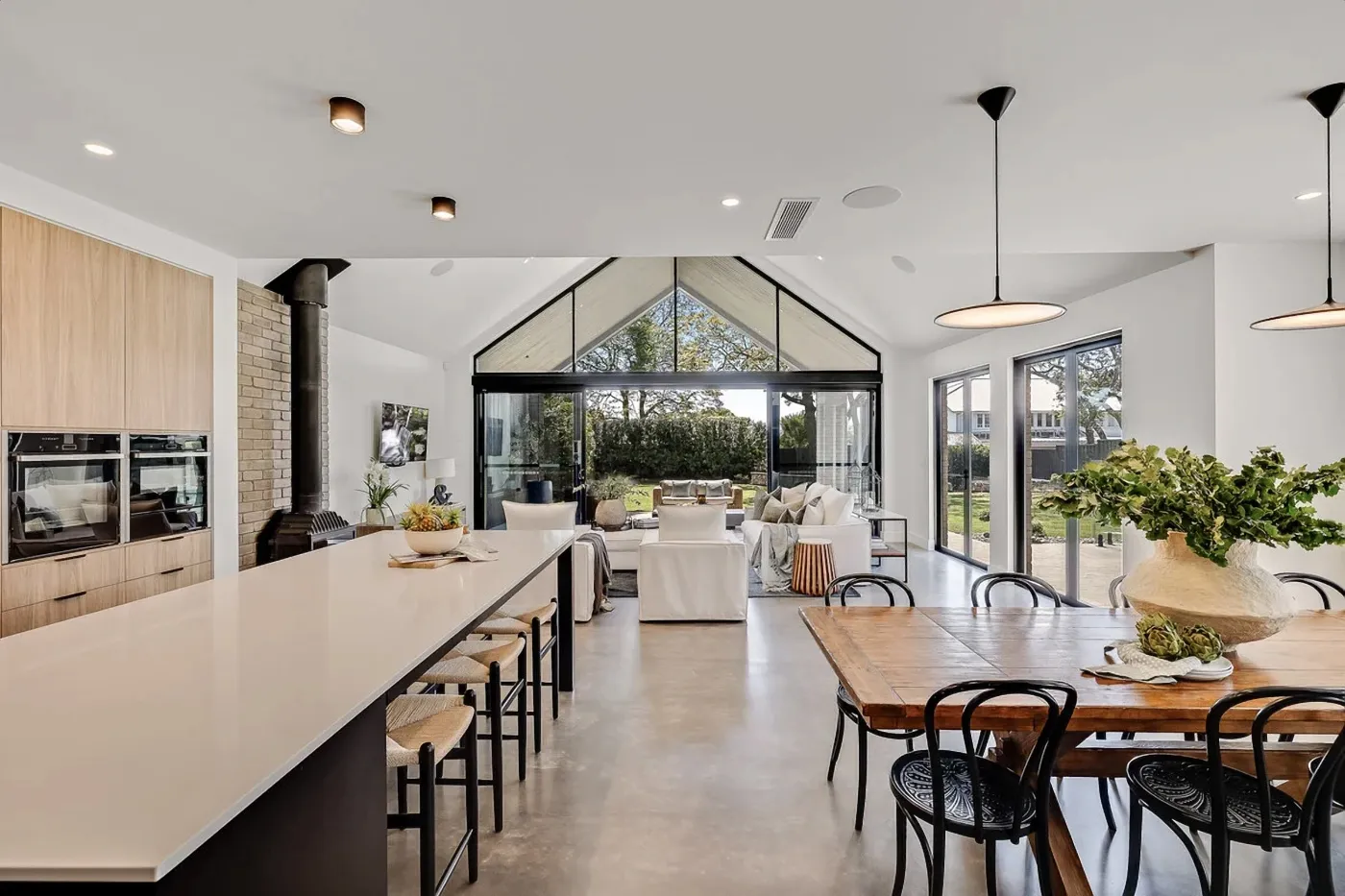 Semi-gloss mechanically polished concrete floor in an open-plan Brisbane home
