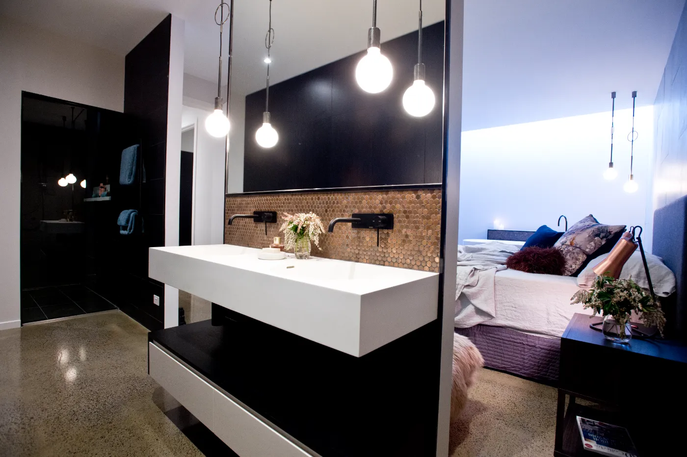 Grind and seal concrete floor with minimum stone exposure and a high gloss finish in a Brisbane ensuite and bedroom