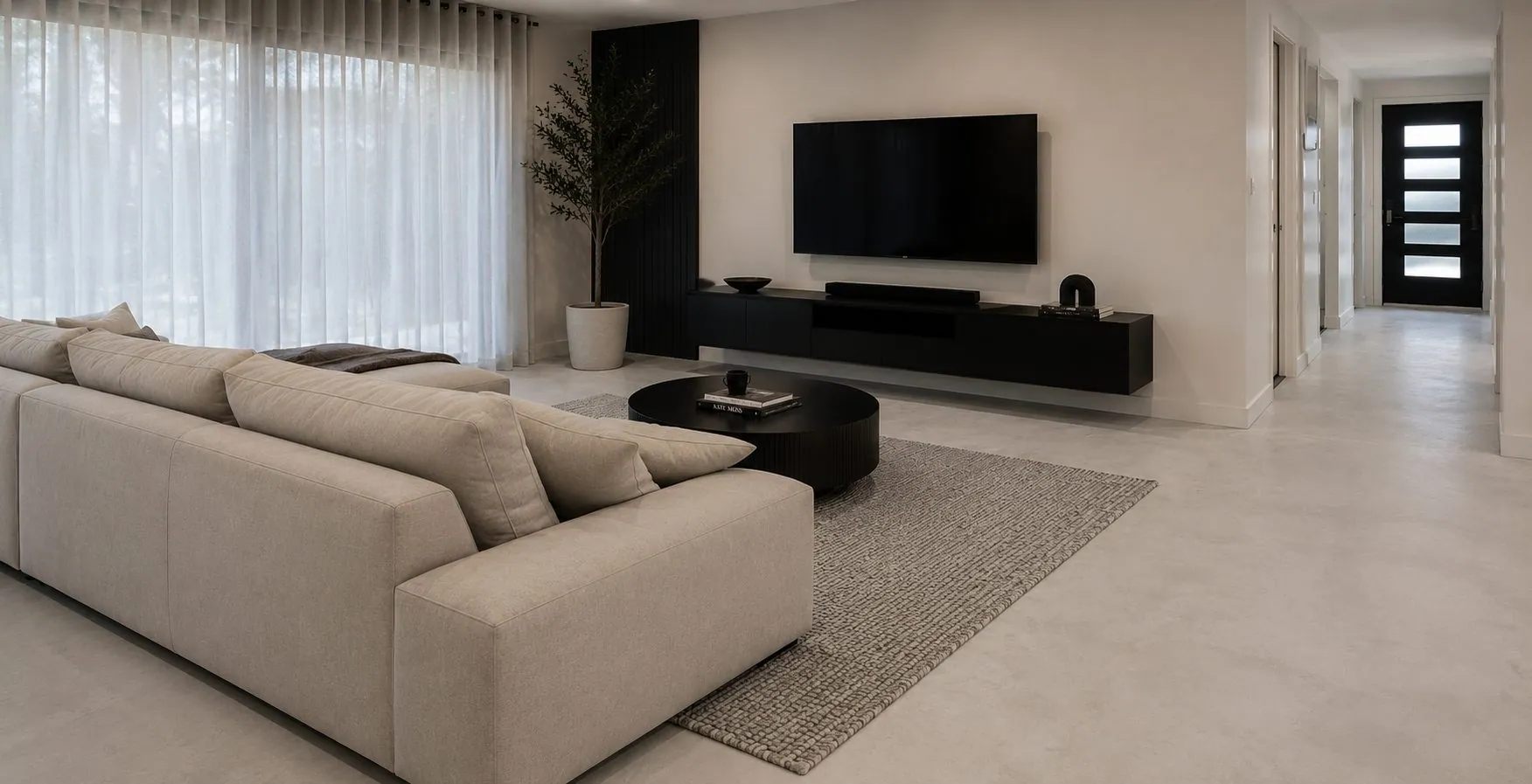 Microcement concrete overlay floor flowing through a modern Brisbane living space