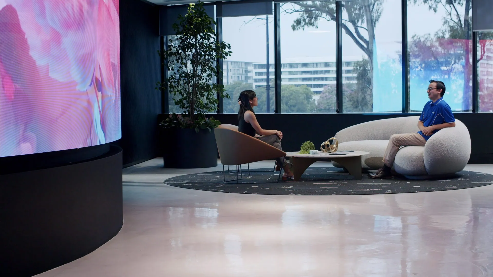 Microcement concrete overlay floor in a modern office lounge, Brisbane