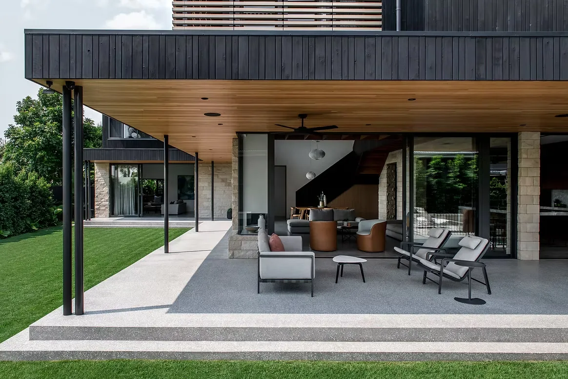 Honed concrete covered patio and steps at a Brisbane home