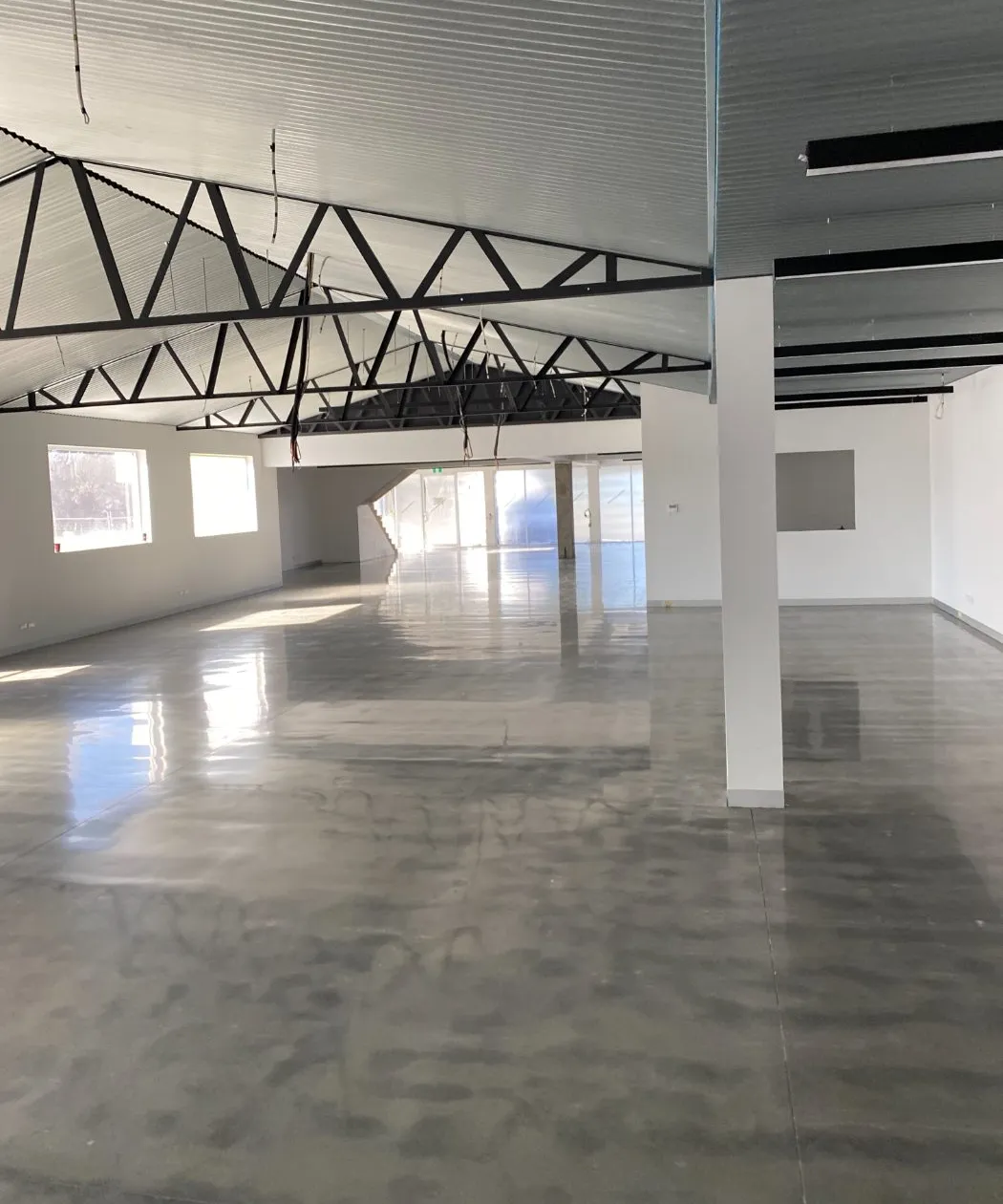High-gloss surface-polished concrete floor in a commercial fit-out