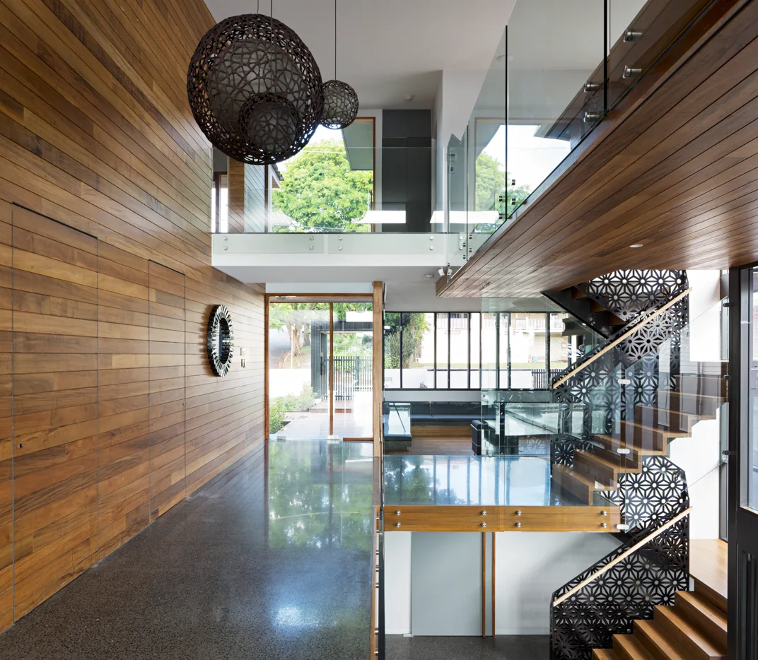 Architect-designed polished concrete floor in a timber-lined Brisbane home
