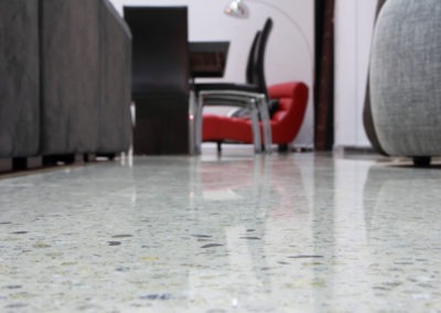 Close-up Of A High-gloss Mechanically Polished Concrete Floor In A Contemporary Living Space.